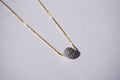 Collar con cadena dorada y bolitas de zirconias plateada
