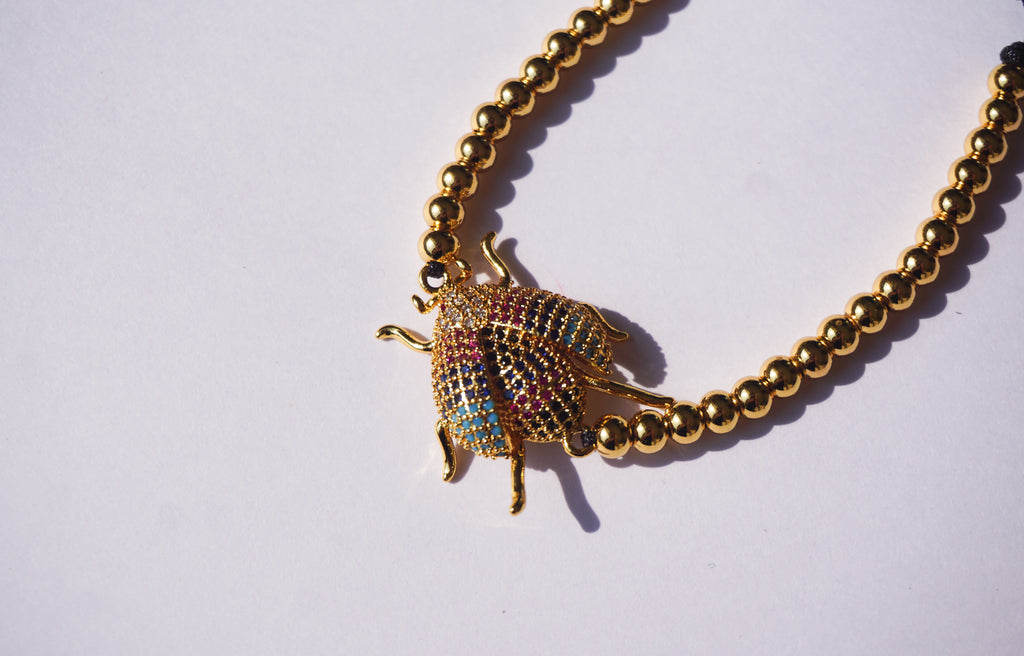 Pulsera dorada de insecto con cierre ajustable