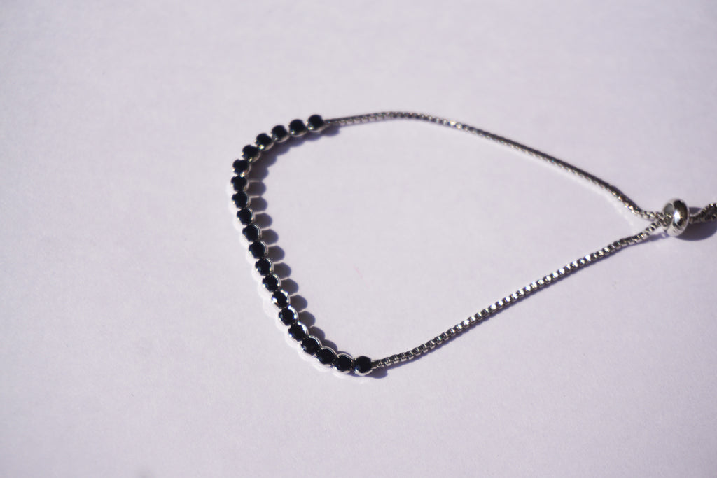 Pulsera tennis plateada con zirconias negras
