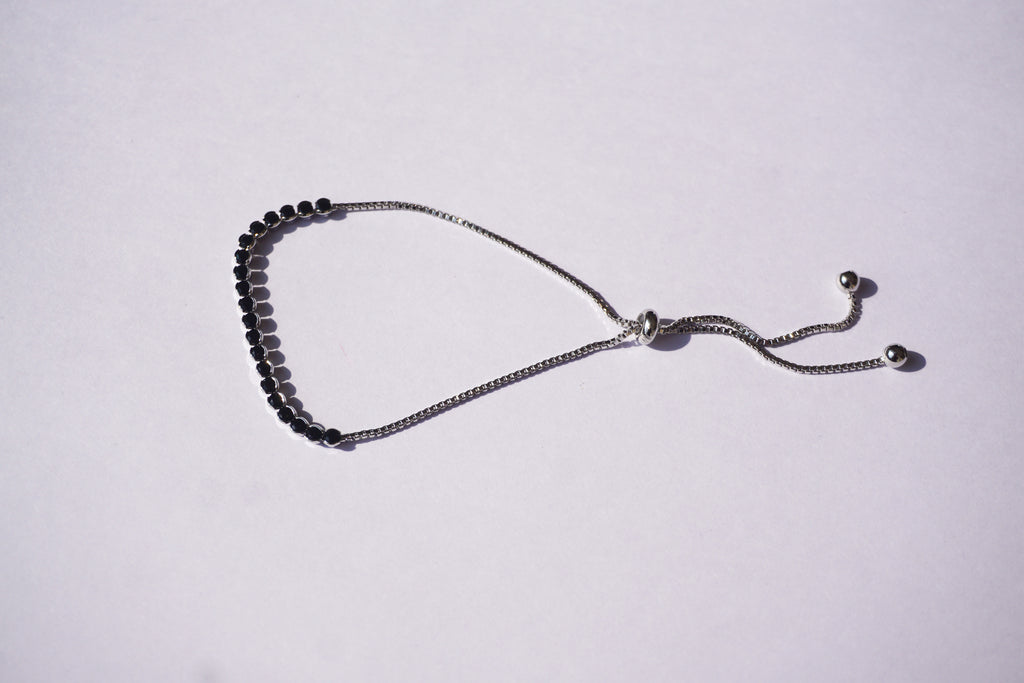 Pulsera tennis plateada con zirconias negras