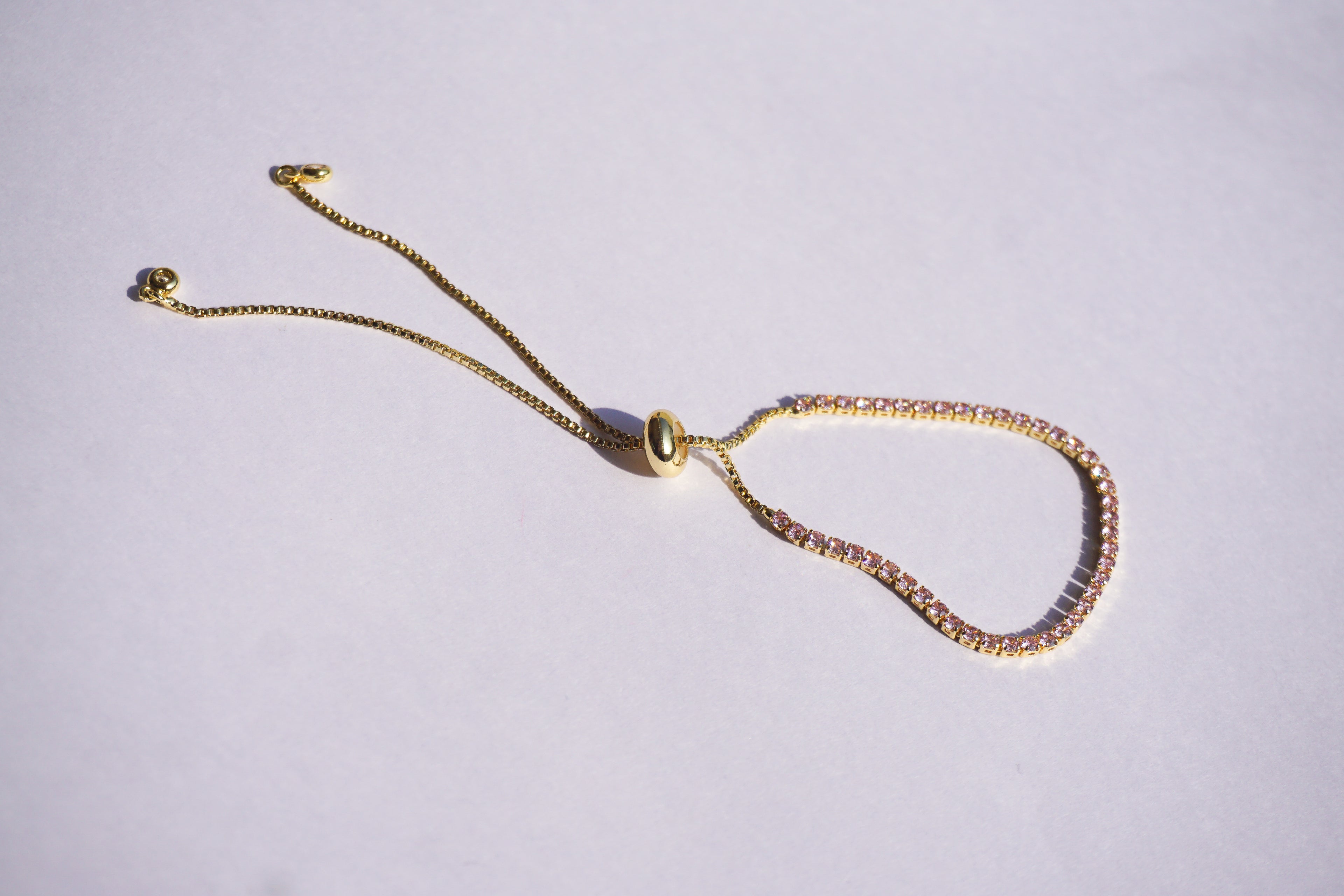 Pulsera tennis dorada con zirconias rosa pastel