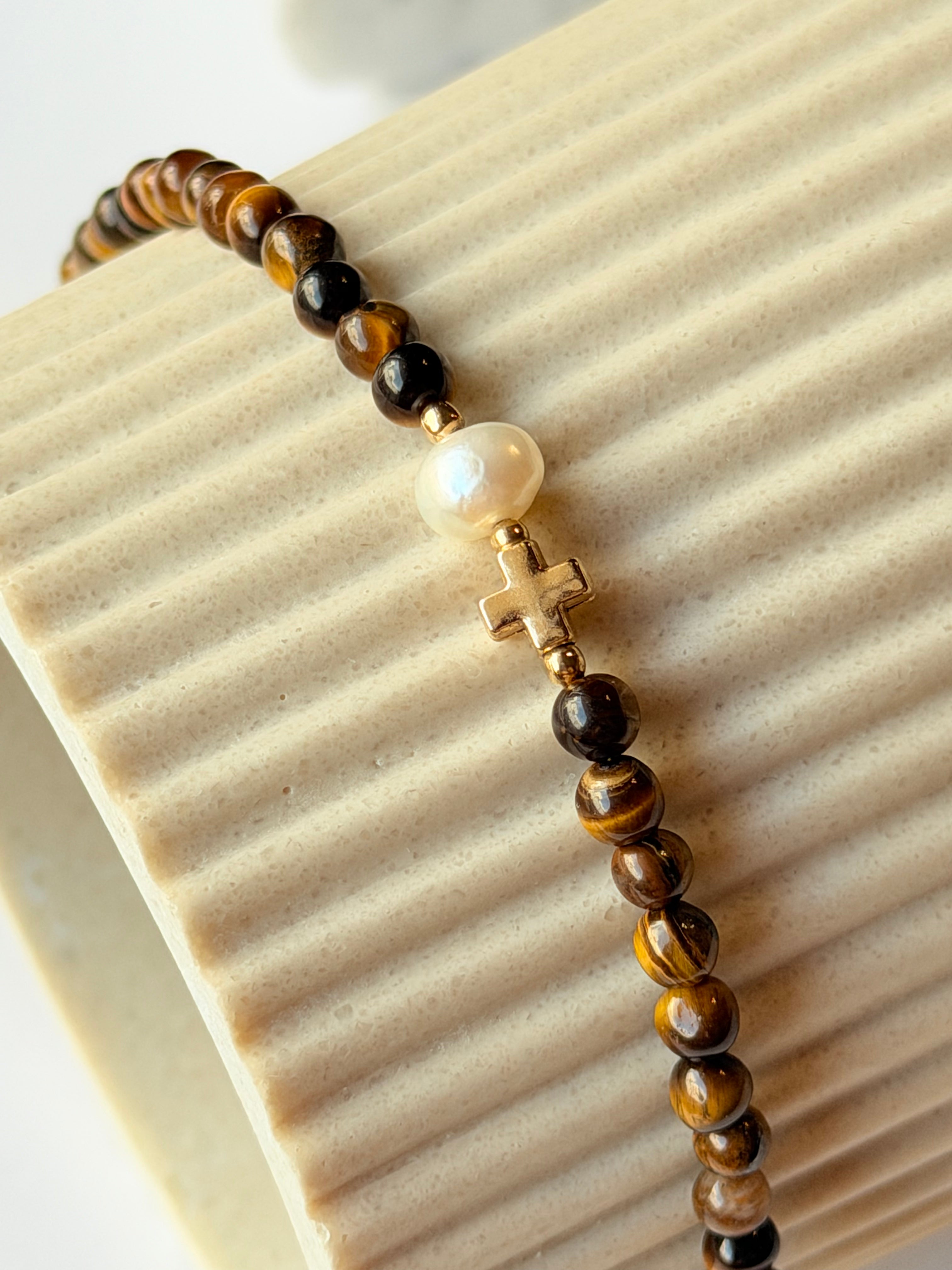 Pulsera de ojo de tigre con perla y cruz