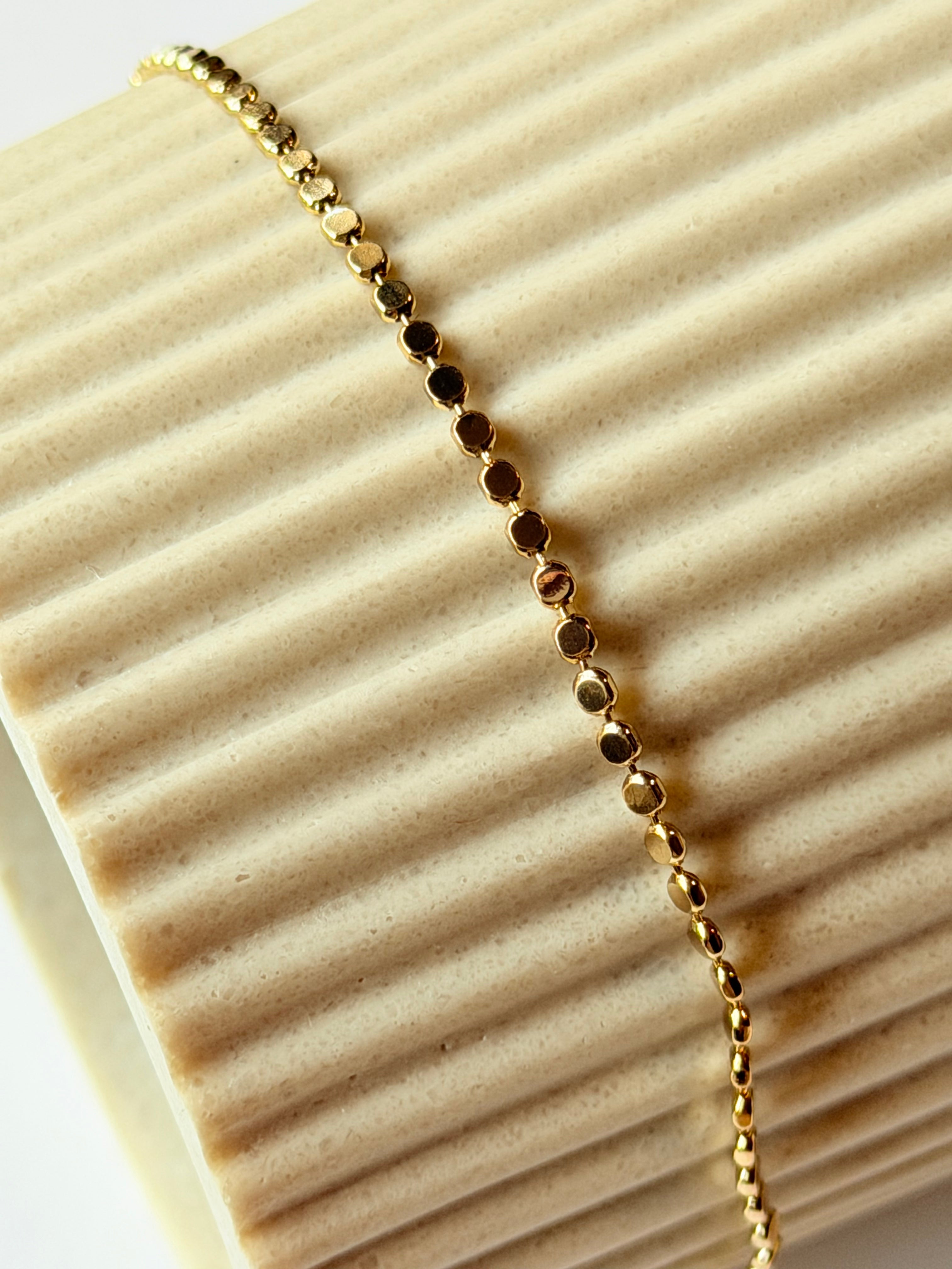 Pulsera de bolita aplastada
