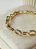 Pulsera eslabones paperclip y oval pavé en chapa de oro