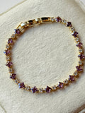 Pulsera tennis con zirconias lilas y transparentes