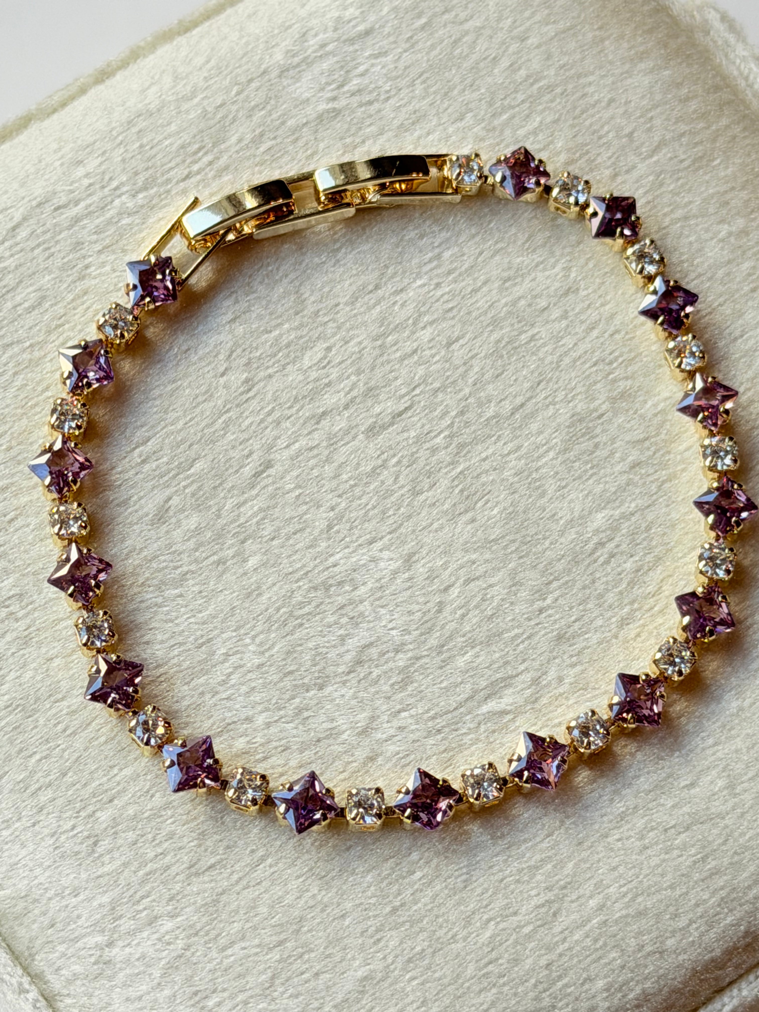Pulsera tennis con zirconias lilas y transparentes