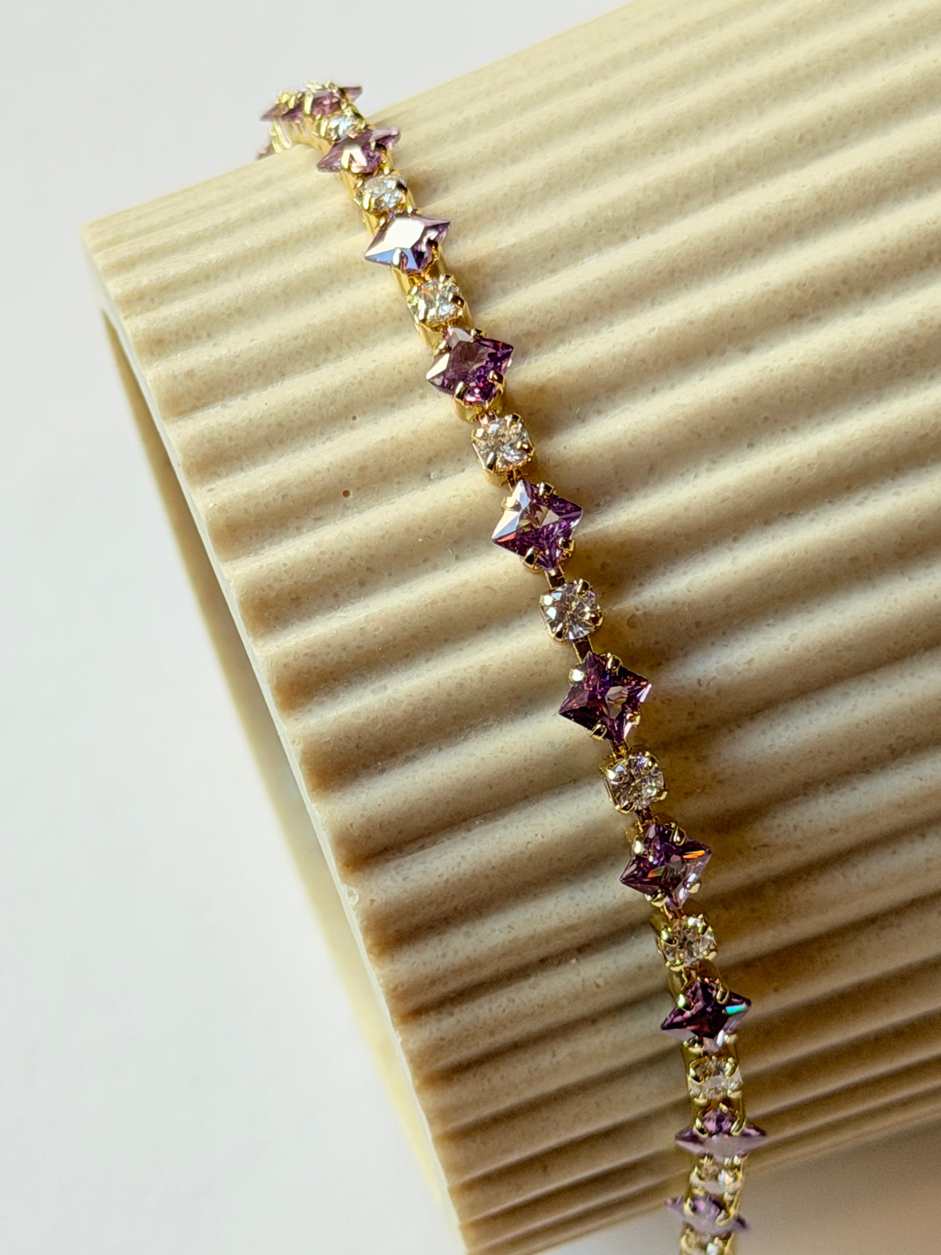 Pulsera tennis con zirconias lilas y transparentes