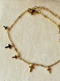Pulsera de acero dorada con mini cruces